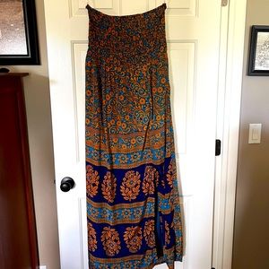 Strapless Moroccan inspired dress with shirred bodice and beautiful blue lining.